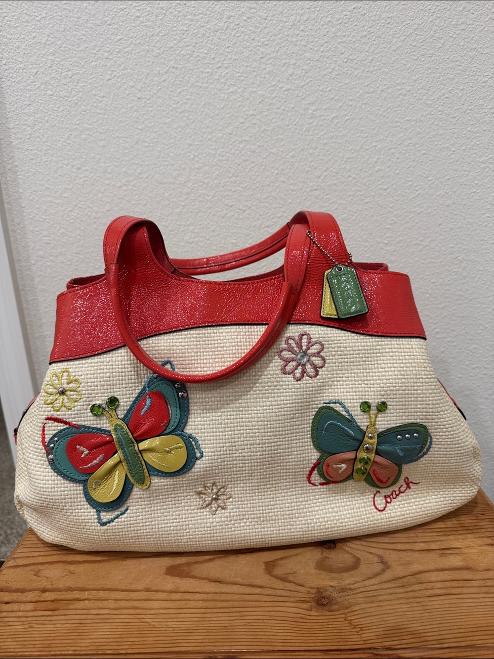 Coach Red-Trim Straw Tote with Colorful Butterfly Embellishments